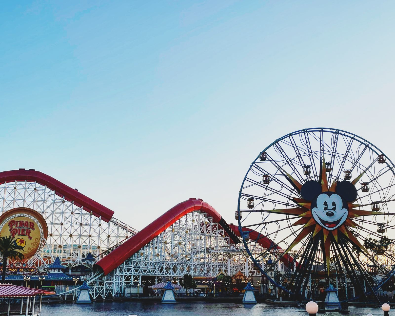 Pixar Pier Ferris wheel and roller coaster on a clear day at the Disneyland Resort in Anaheim